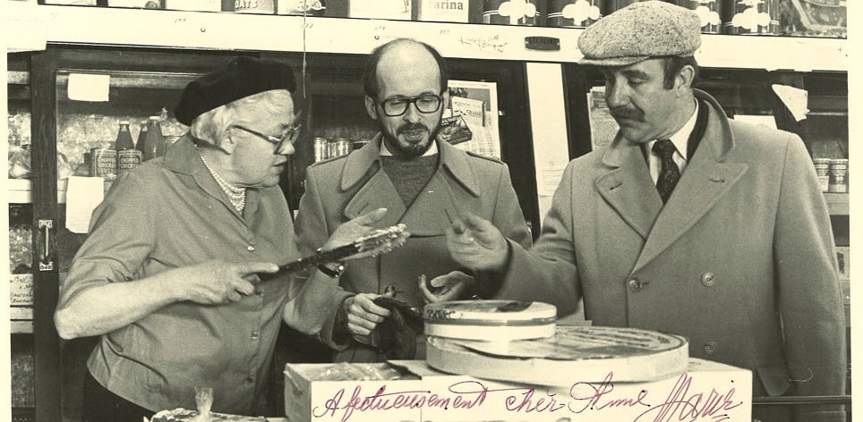 Jack Farrell and Phillip Brunelle with a Minneapolis shop owner